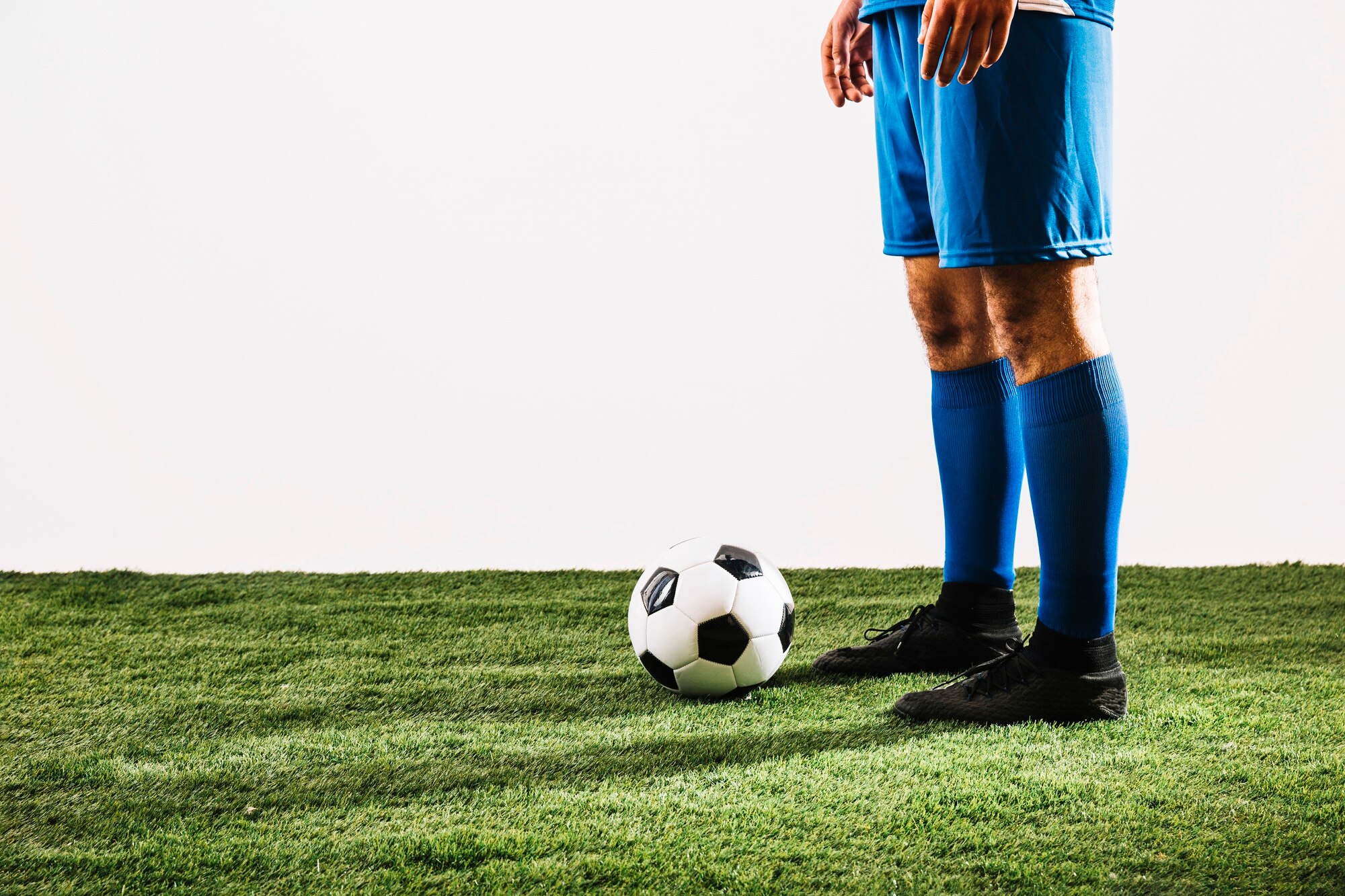 crop-football-player-near-ball_23-2147817346